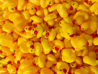 Top View of Dense Pile of Yellow Rubber Ducks with Red Beaks