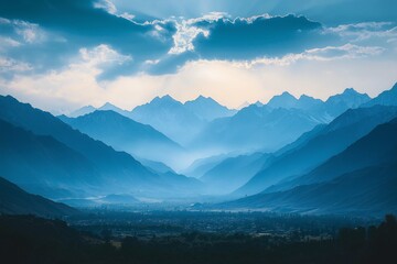 Obraz premium Majestic Mountain Range at Sunset. Tranquil Valley and Idyllic Landscape with Vibrant Colors and Dramatic Sky