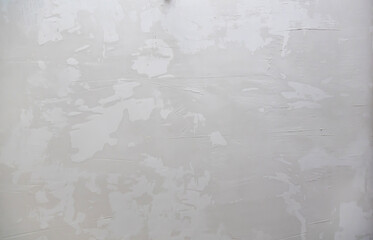 Starter gypsum plaster. Abstract background, textured plaster, spatula strokes.