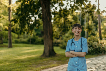Smiling nurse enjoying a peaceful park stroll