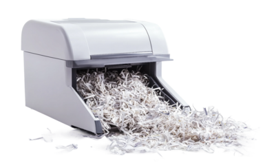 Paper shredder with partially shredded outdated documents in office setting isolated on transparent background PNG