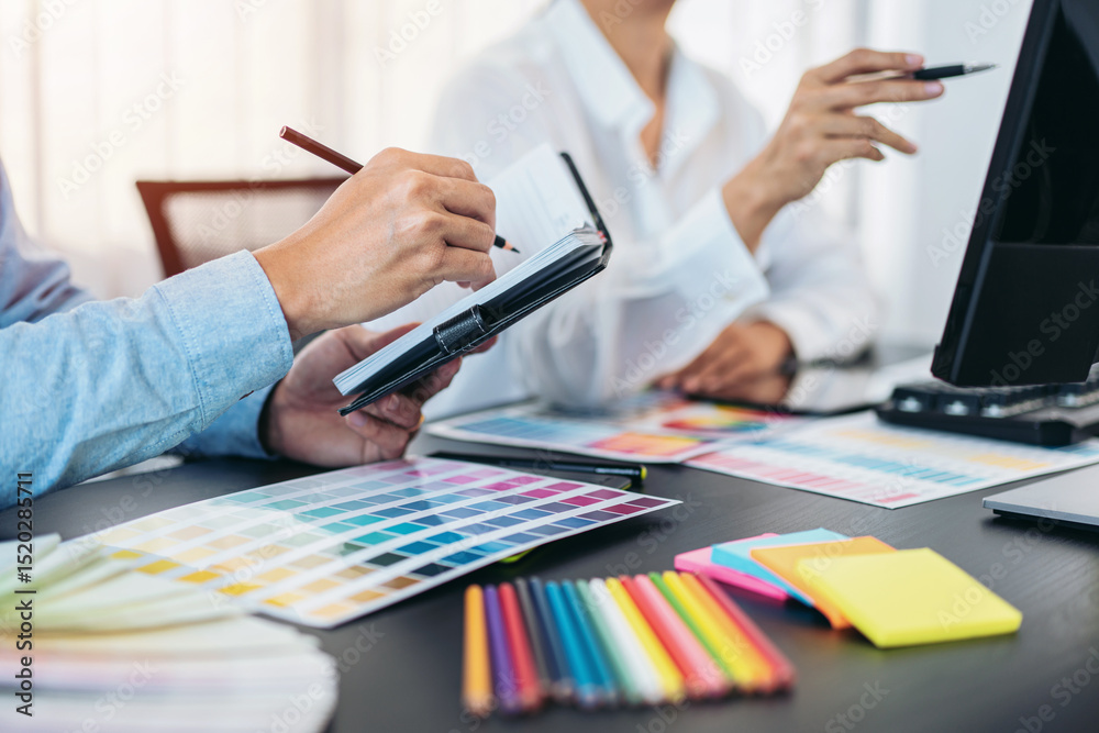 Poster team of creative graphic designer working on color swatch samples chart for selection coloring in in