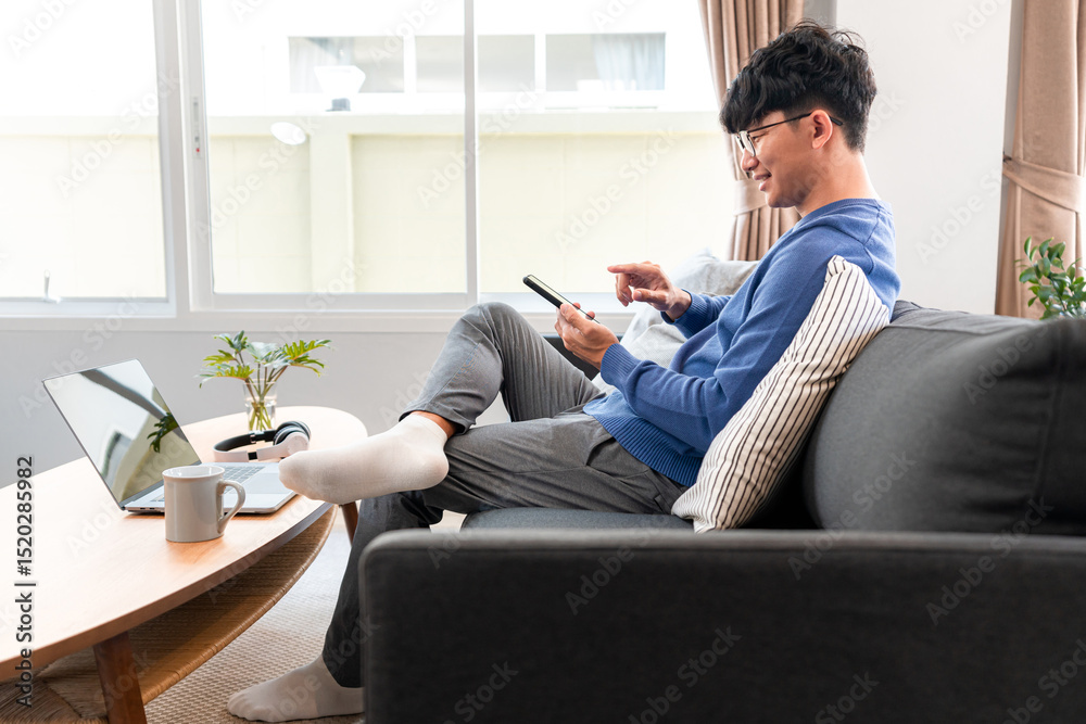 Poster asian man in casual clothes, using smartphone to working about business project from home and checki