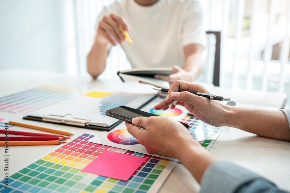 Aufkleber Team of creative graphic designer working on color swatch samples chart for selection coloring in inspiration to create new collection at workplace