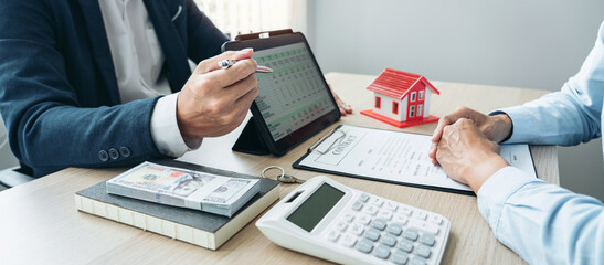 Real estate broker agent consulting the customer to a decision making sign insurance form agreement contract
