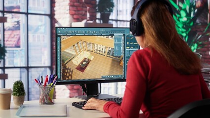 Designer interacts with digital technology to produce a virtual home set. Architectural software enables 3D modeling and rendering, placement of furniture and layout adjustments. Camera A.