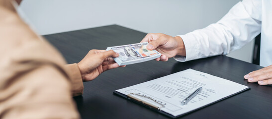 Fototapeta premium Bribe employer offer terms to a businessman for signing on contract while making corruption about real estate