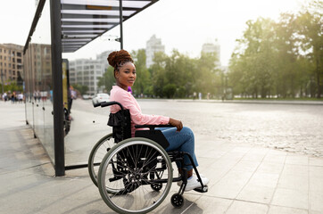 Problem of public transport for people with disabilities. Young black handicapped woman in...
