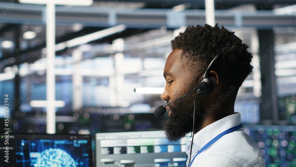 Poster data center employee talking in headset mic, coordinating technicians setting up hardware for artifi