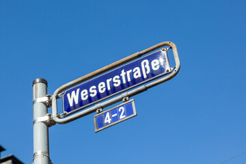 Fototapeta premium street name weserstrasse - river Weser - at an old enamel street sign in Frankfurt in the red light district