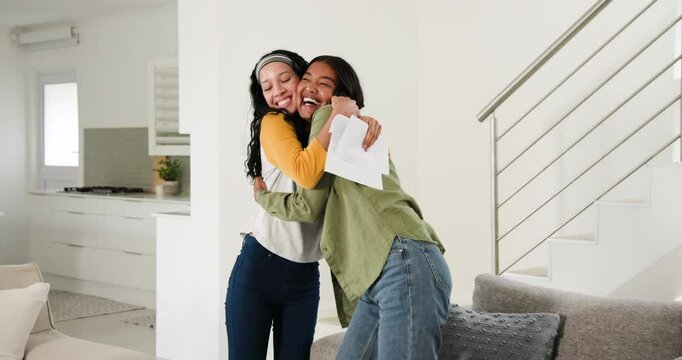Mother and teenage daughter reading acceptance letter on couch, hugging and calling family on phone