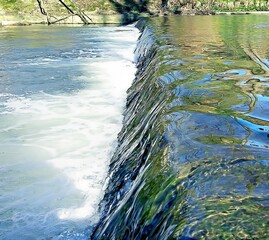Wildlife. Mountain river. Thresholds of water sources. Transparent water. Movement of water in nature. Close-up. refreshing condition Wallpaper. Postcard