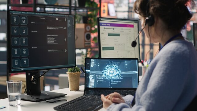Worker providing live chat support, typing on keyboard, using AI chatbot to handle clients complaints. Call center agent dealing with unsatisfied customers using artificial intelligence LLM, camera A - Powered by Adobe