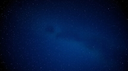 Dark night sky with subtle stars, creating a serene and tranquil atmosphere.