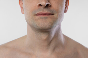 Obraz premium Man after shaving on white background, closeup