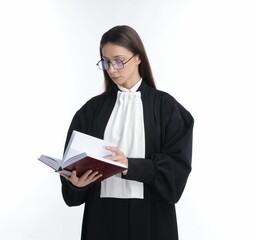 Judge in glasses reading book on white background