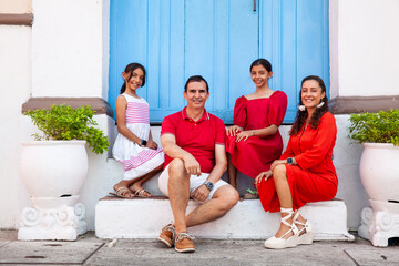 Young family of four traveling together. Family love concept. Travel concept. Cartagena de Indias.