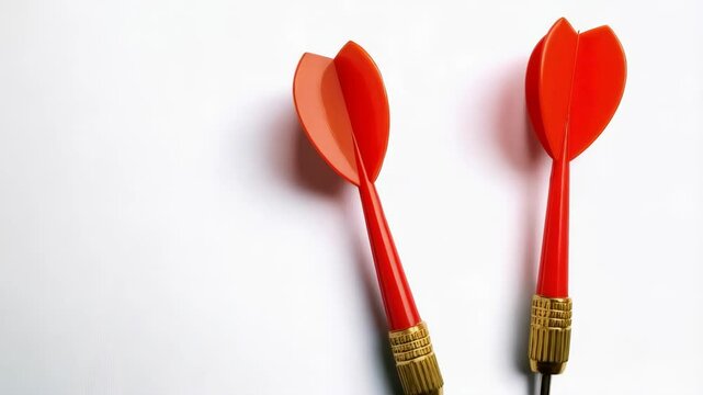 Two red dart arrows for target precision on clean background emphasizing accuracy and focus