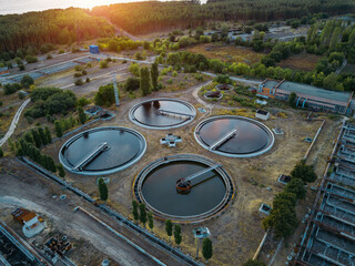 Modern wastewater treatment plant, aerial view from drone at the evening sunset