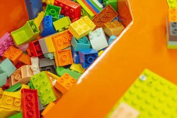 Colorful building blocks laid out for creative play in a cheerful indoor play area filled with...