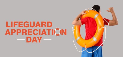 Beach rescuer with lifebuoy on grey background. Banner for Lifeguard Appreciation Day