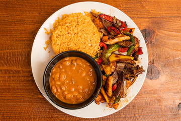 Mixed meats with rice and beans