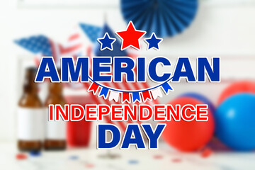 USA flag, beer bottles and balloons on table near white wall. Independence Day celebration