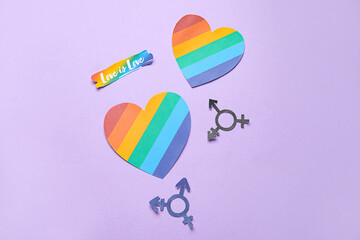 Text LOVE IS LOVE with paper hearts and transgender symbols on lilac background