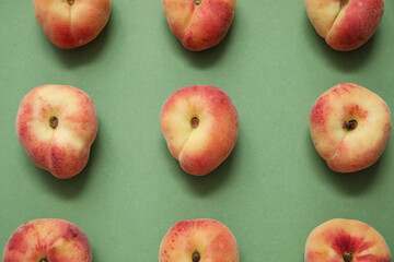 Sweet fig peaches on green background