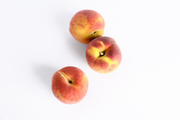 Sweet peaches on white background