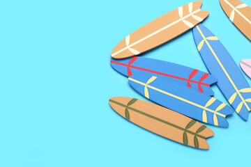 Different mini surfboards on blue background