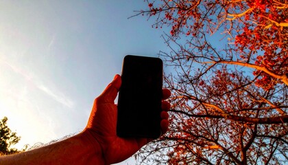 His grip shows familiarity with technology.  