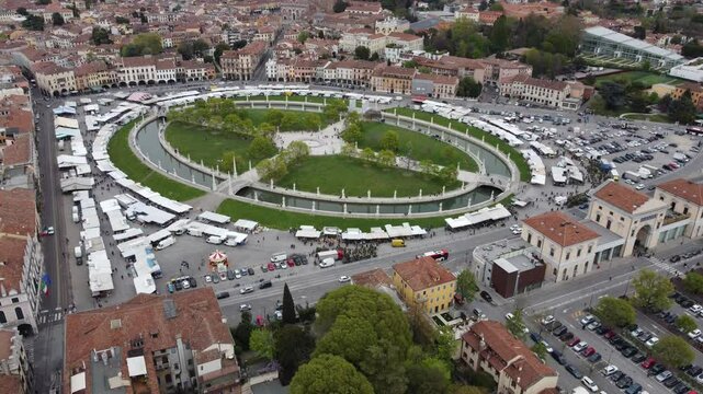 Aerial view of Prato della Valle in Padova, showcasing one of Europe&rsquo;s largest squares with its iconic elliptical canal and statues.