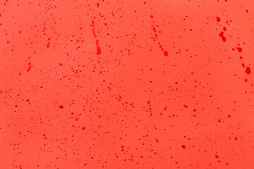 Closeup view of blood splashes on red background