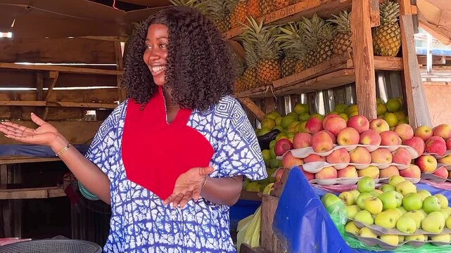 excited business woman selling fruit in local african fruit market