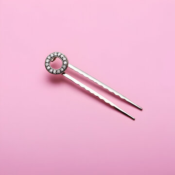 Hair-pin on the pink isolated background