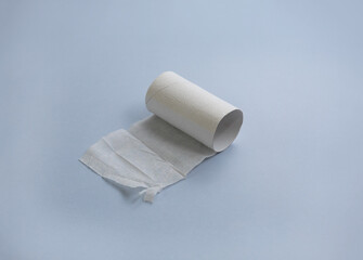 Finished roll of toilet paper on grey background. Diarrhea or digestive disorder concept. Selective focus, copy space