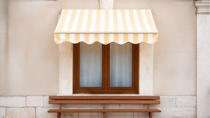 small balcony with striped fabric canopy and wooden bench under window