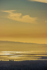 Dumbarton Bridge at sunset with reflections over Baylands water in the South Bay