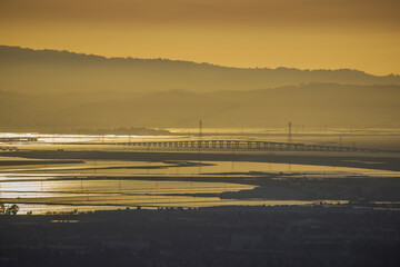 Dumbarton Bridge at sunset with reflections over Baylands water in the South Bay