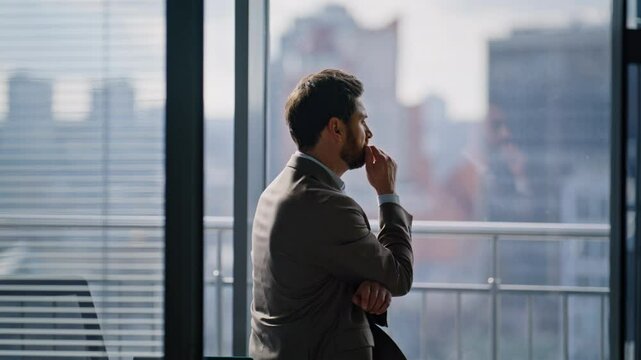 Sad professional thinking problem at cityscape office closeup. Worried manager