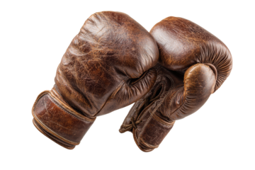 Two old leather boxing gloves are shown in a close up