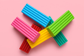 Colorful plasticine on pink background