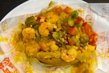 Classic abará from Bahia prepared with palm oil, shrimp, vatapá, caruru and spices