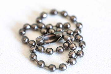 Small metal chain with balls and ingenious clasp