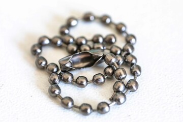 Small metal chain with balls and ingenious clasp