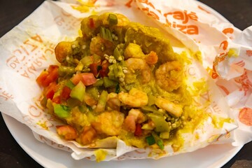 Classic abará from Bahia prepared with palm oil, shrimp, vatapá, caruru and spices