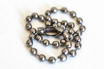 Small metal chain with balls and ingenious clasp