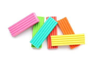 Many colorful plasticine on white background