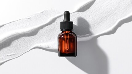 Amber glass dropper bottle on white smear